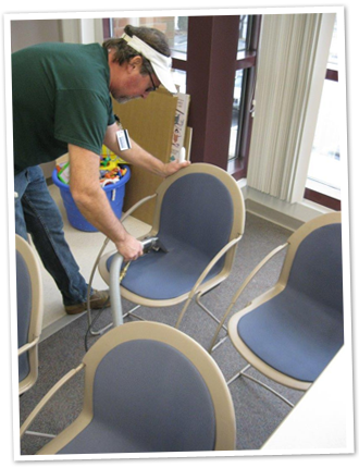 Bob Green cleaning a chair